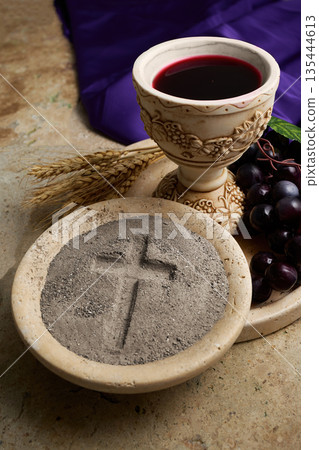 Ash wednesday symbolism with communion chalice and grapes Ash wednesday symbolism with communion chalice and grapes 135444613