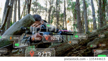 Aiming soldier in camouflage vest lying behind log in pine forest, with scoped rifle, AR overlays Aiming soldier in camouflage vest lying behind log in pine forest, with scoped rifle, AR overlays 135444615
