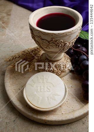 Holy communion eucharist elements on stone tray 135444642