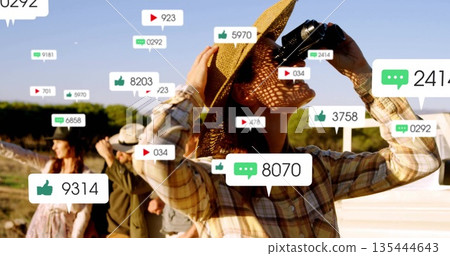 Peering through binoculars woman wearing straw hat beside pickup truck, with social icons Peering through binoculars woman wearing straw hat beside pickup truck, with social icons 135444643