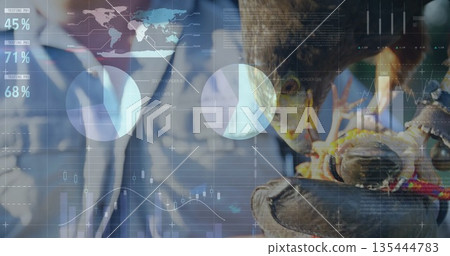 Displaying falconer holding falcon on leather glove in presentation studio, with holographic data Displaying falconer holding falcon on leather glove in presentation studio, with holographic data 135444783