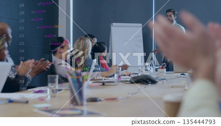 Presenting man in suit showing diagrams in meeting room with flipchart and laptop, copy space 135444793
