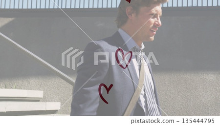 Ascending man in business attire climbing urban stairs beside handrail, red heart graphics overlay Ascending man in business attire climbing urban stairs beside handrail, red heart graphics overlay 135444795