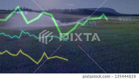Spraying center pivot irrigation sprinkler arm watering cereal crops at farm, with numeric overlays 135444819