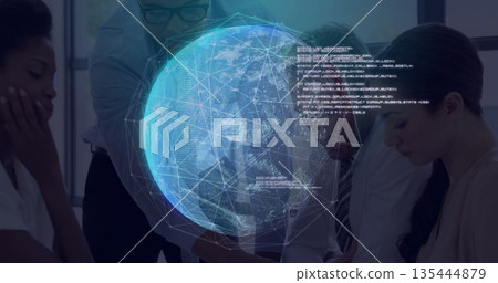 Studying network data business team leaning over conference table in office with holographic globe 135444879