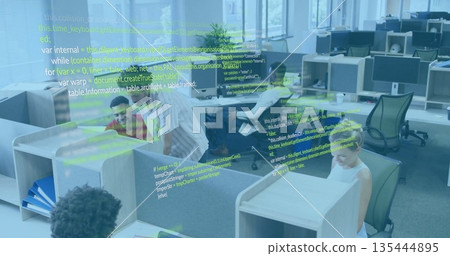 Coding software engineers typing code in open plan office, with monitors and code overlay 135444895
