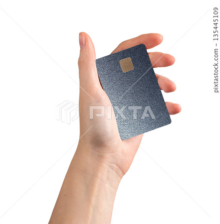 Bank card in hand close up with chip. Plastic credit payment for shopping, purchase and trade Bank card in hand close up with chip. Plastic credit payment for shopping, purchase and trade 135445109