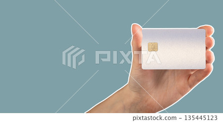 Bank card in hand finance close up. Plastic chip for payment, purchase and commerce trade. Finance 135445123