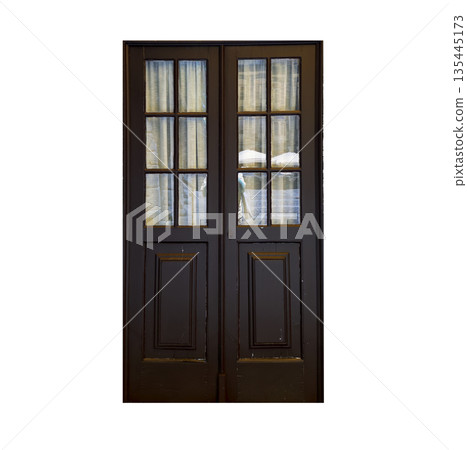 Brown wooden door with glass panels and curtains, traditional architectural detail. Vintage entrance Brown wooden door with glass panels and curtains, traditional architectural detail. Vintage entrance 135445173