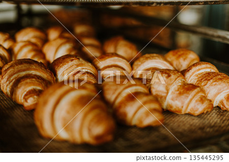 Baking croissant cookies. 135445295