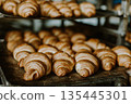 Baking croissant cookies. 135445301