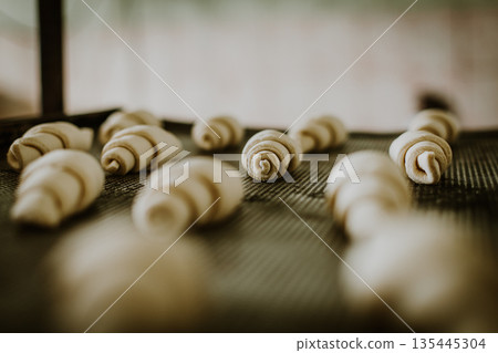 Making croissants Making croissants 135445304