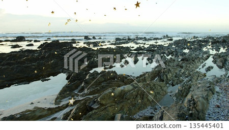 Displaying jagged intertidal coast revealing tidal pools at low tide, with gold star overlays 135445401
