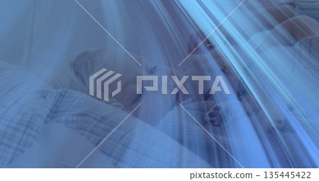 Sleeping child girl resting under knit blanket on bed, with pillow, checkered sheet and plush toy 135445422