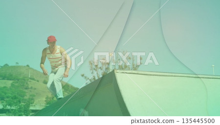 Balancing skateboarder wearing red cap and striped top on metal ramp at skate park, copy space Balancing skateboarder wearing red cap and striped top on metal ramp at skate park, copy space 135445500