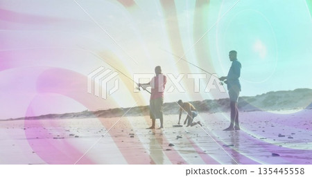 Examining tidal pools father kneeling between adult sons on coastal beach, with fishing rods Examining tidal pools father kneeling between adult sons on coastal beach, with fishing rods 135445558