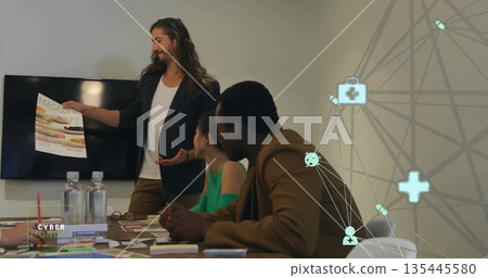 Presenting man holding magazine mockup in conference room, with water bottles eyeglasses 135445580