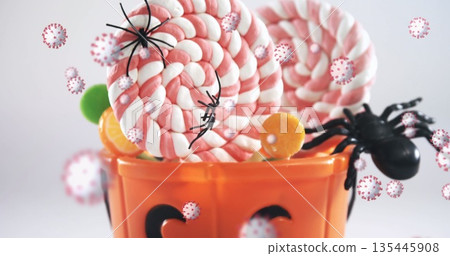 Image of halloween candy and spiders with multiple cells floating on white background Image of halloween candy and spiders with multiple cells floating on white background 135445908