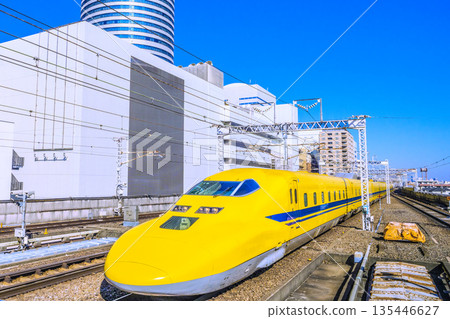 Yokohama cityscape in Japan: Towards a happy era. View of Doctor Yellow and Yokohama Prince Hotel approaching Shin-Yokohama Station. 135446627