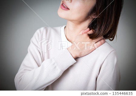 Middle woman suffering from stiff shoulders Middle woman suffering from stiff shoulders 135446635