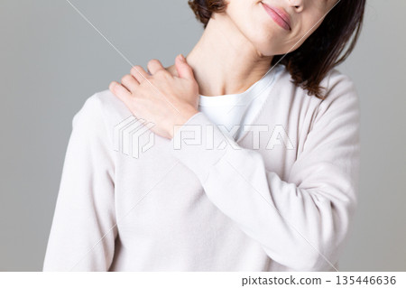 Middle woman suffering from stiff shoulders 135446636