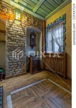 Rustic hallway detail with antique clock and mosaic window Rustic hallway detail with antique clock and mosaic window 135447124
