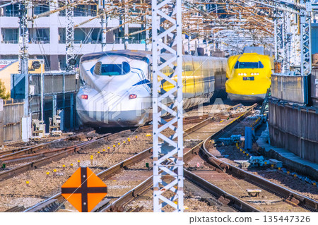 Yokohama cityscape in Japan: countless overhead power lines and rails... Doctor Yellow, the eye that watches over the safety of the Shinkansen. On the left is the N700S 135447326