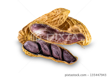 The whole and opened shell peanut or groundnut isolated on white background. The whole and opened shell peanut or groundnut isolated on white background. 135447943