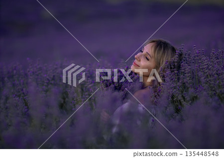 Lavender Field Woman Summer: Serene woman enjoying Provence lavender field at sunset, peaceful moment. Lavender Field Woman Summer: Serene woman enjoying Provence lavender field at sunset, peaceful moment. 135448548