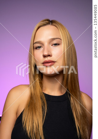 Close-up beauty portrait highlighting smooth, radiant skin, natural makeup, and a fresh healthy complexion in modern studio lighting. Close-up beauty portrait highlighting smooth, radiant skin, natural makeup, and a fresh healthy complexion in modern studio lighting. 135449085