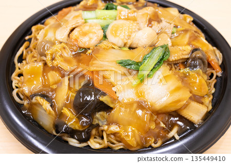 Delicious thick fried noodles with plenty of vegetables Delicious thick fried noodles with plenty of vegetables 135449410