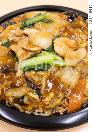 Delicious thick fried noodles with plenty of vegetables Delicious thick fried noodles with plenty of vegetables 135449413