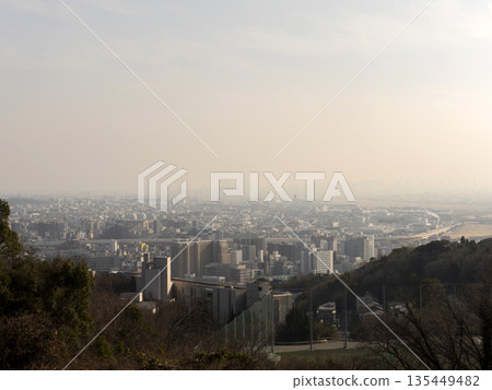 View of the cityscape covered in yellow sand from the observation deck View of the cityscape covered in yellow sand from the observation deck 135449482
