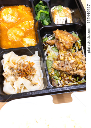 Delicious Chinese bento, shrimp chili and fried chicken bento Delicious Chinese bento, shrimp chili and fried chicken bento 135449617
