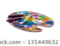 Isolated object for creativity. Oval wooden artist palette covered with colorful spots of dry and fresh paint, featuring two palette knives. Concept of art, hobby, painting, and inspiration 135449632