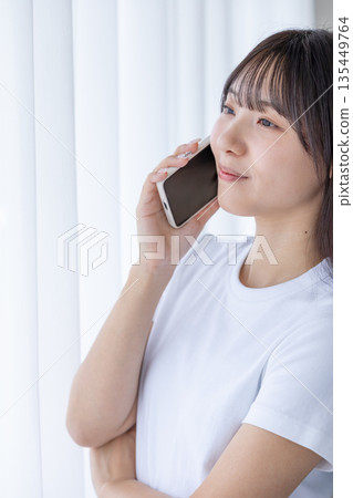 A young woman with a smartphone A young woman with a smartphone 135449764