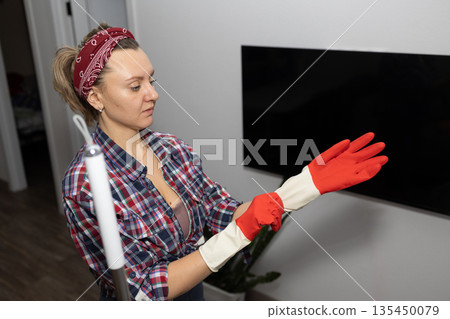 Woman Wearing Red Cleaning Gloves Preparing to Mop the Floor at Home 135450079