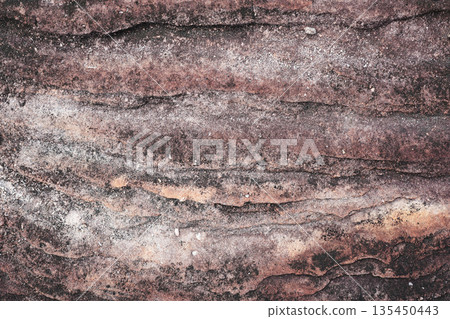 Old ancient rustic stone wall with ridge layered texture 135450443