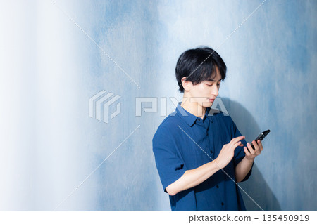 A man in a navy shirt 135450919