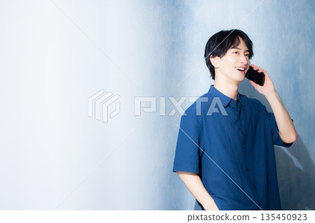 A man in a navy shirt 135450923
