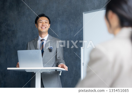 A man speaking at a seminar 135451085