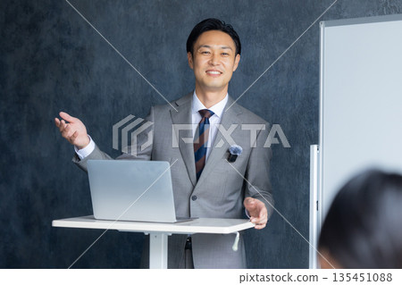 A man speaking at a seminar A man speaking at a seminar 135451088