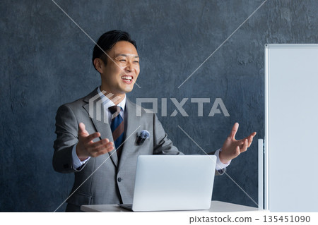 A man speaking at a seminar A man speaking at a seminar 135451090