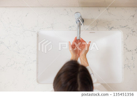 Woman in bathrobe Woman in bathrobe 135451356