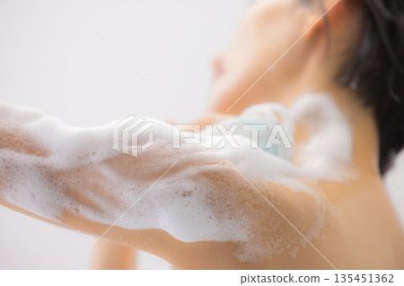 A woman taking a bath A woman taking a bath 135451362