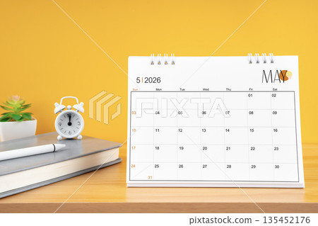 May desk calendar for 2026 year on work table. May desk calendar for 2026 year on work table. 135452176