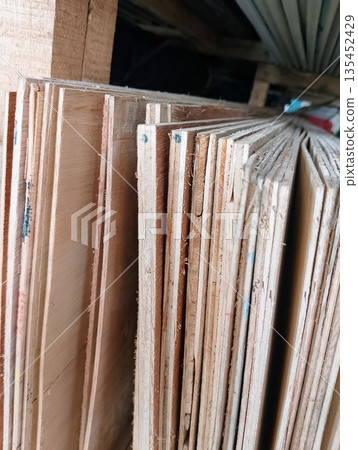 Stacked Plywood Sheets in Hardware Store for Construction and Carpentry 135452429