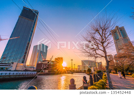 Yokohama cityscape, Japan, January 13th. View of Yokohama Landmark Tower and sunset from Kishamichi Yokohama cityscape, Japan, January 13th. View of Yokohama Landmark Tower and sunset from Kishamichi 135452448