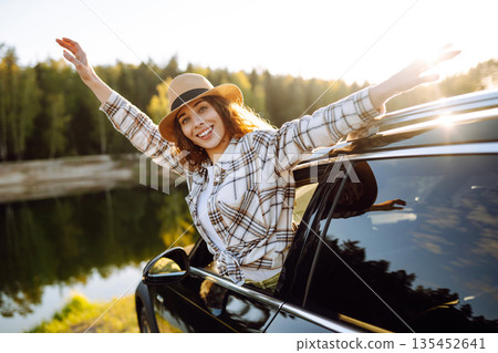 Road trip travel, woman and car window freedom to relax in summer, outdoor adventure. Active life. Road trip travel, woman and car window freedom to relax in summer, outdoor adventure. Active life. 135452641