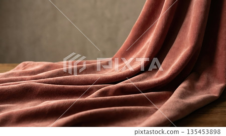 Luxurious velvet fabric with soft folds and a rich plush texture 135453898